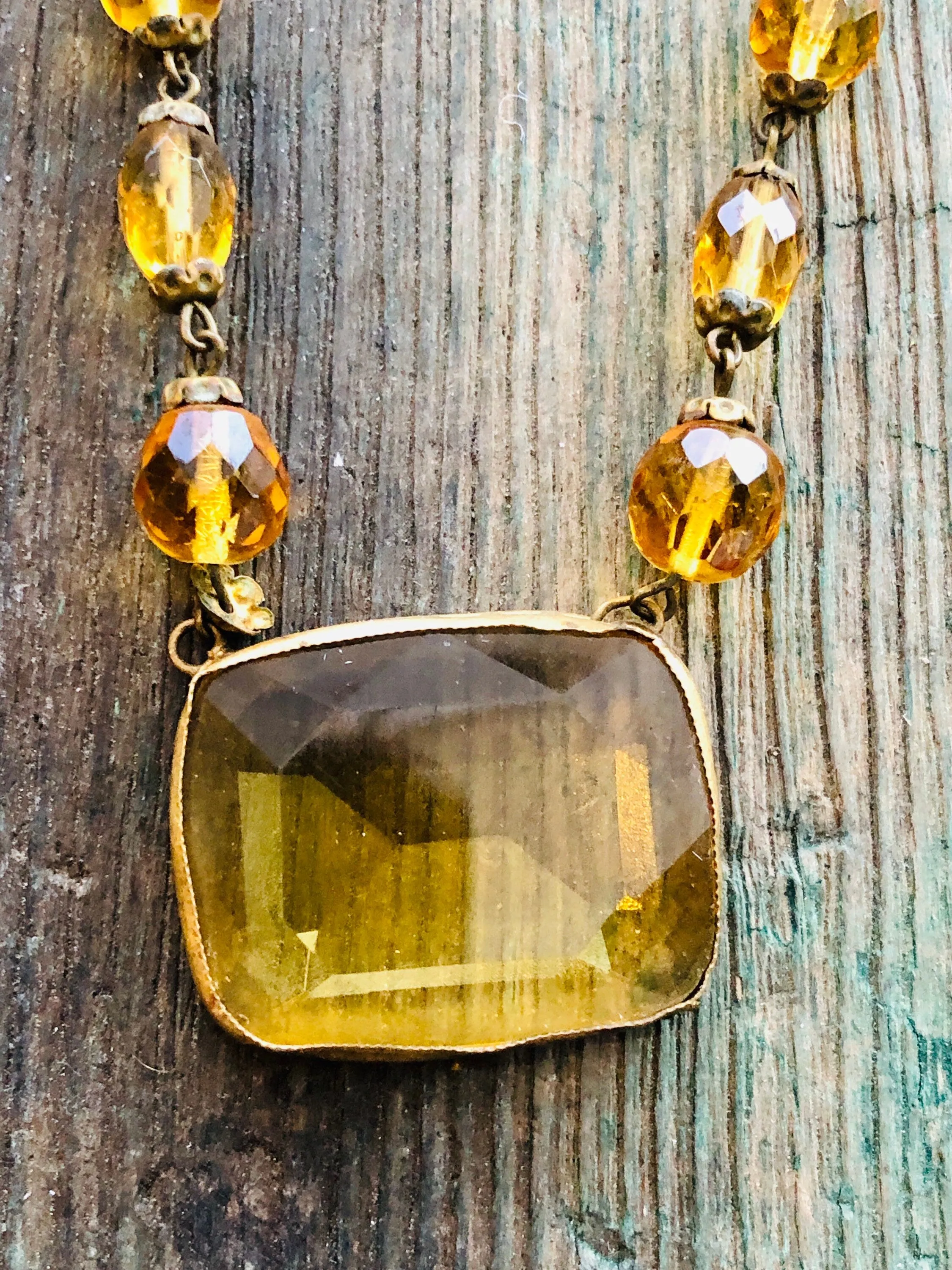 Antique Czechoslovakian Citrine Crystal Necklace with large Brass set center faceted stone and faceted crystal beads