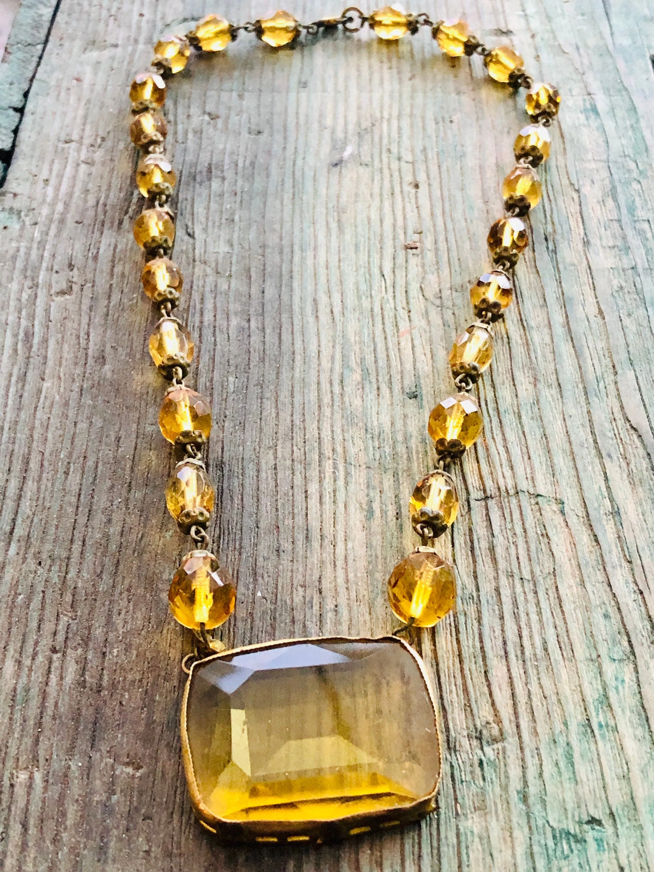 Antique Czechoslovakian Citrine Crystal Necklace with large Brass set center faceted stone and faceted crystal beads
