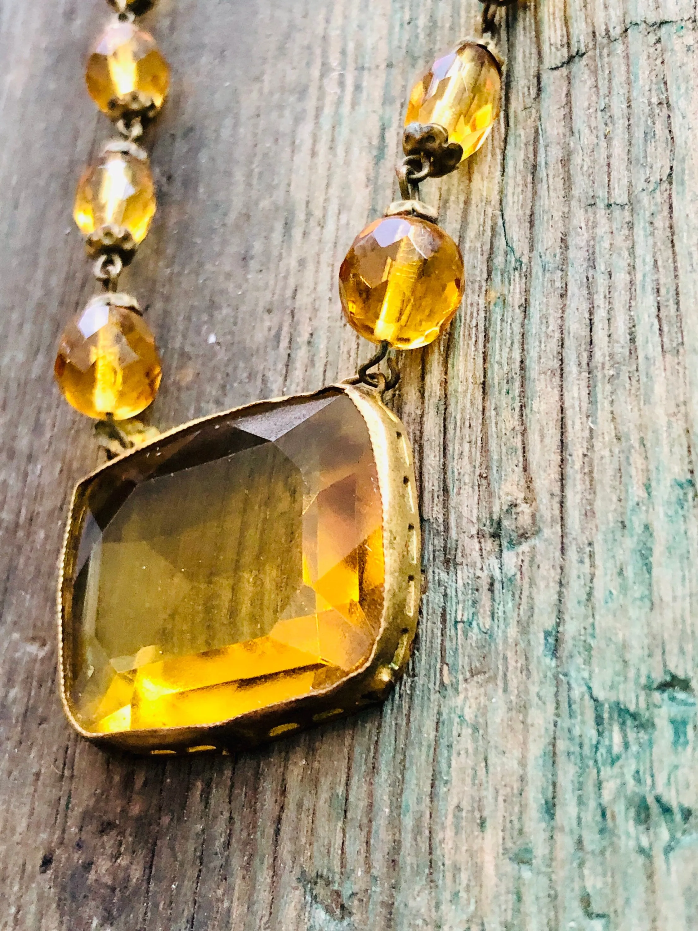 Antique Czechoslovakian Citrine Crystal Necklace with large Brass set center faceted stone and faceted crystal beads