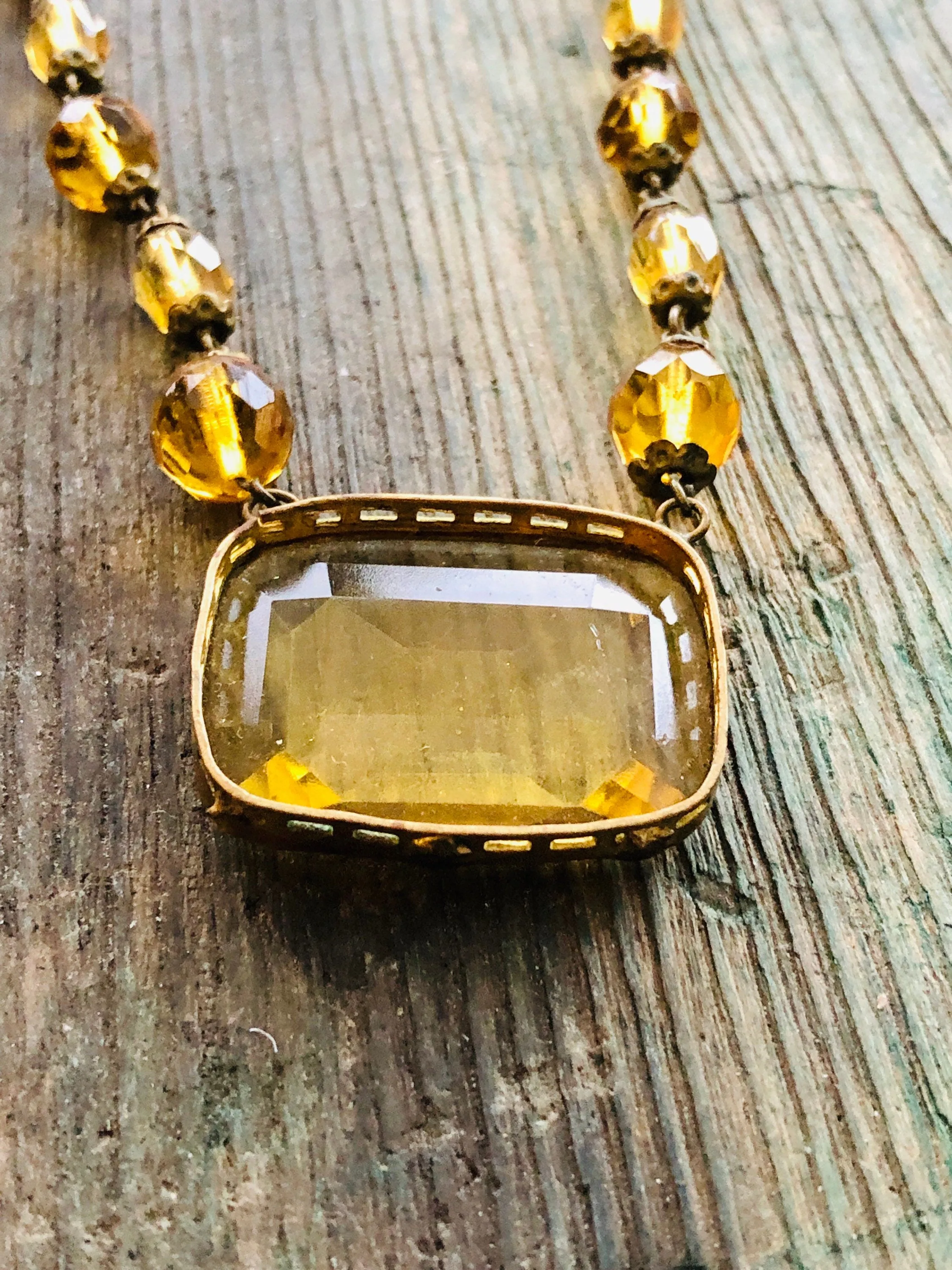 Antique Czechoslovakian Citrine Crystal Necklace with large Brass set center faceted stone and faceted crystal beads